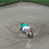 Making a Sand Angel at the Annual Golf Tournament